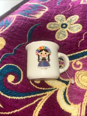White Ceramic Mug with Colorful Folk Doll Design from Mexico